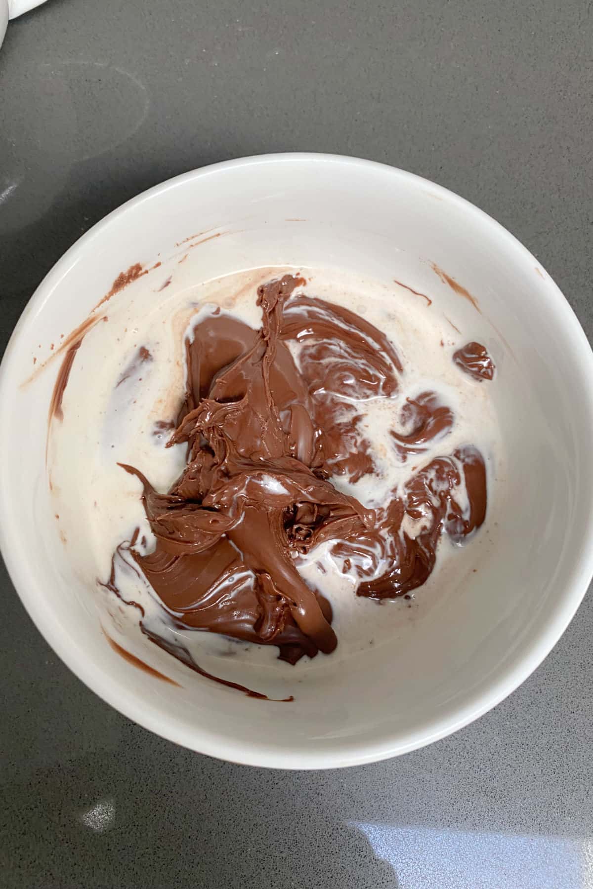 Nutella and cream in bowl.