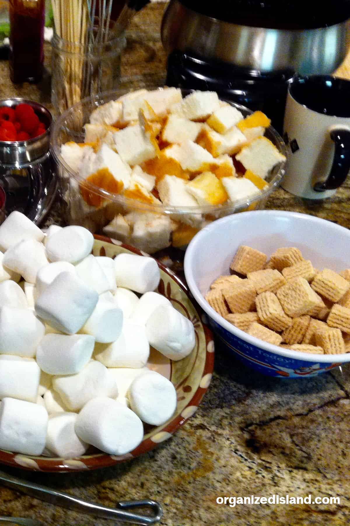 Marshmallows, angel food cake and bread for a fondue party.