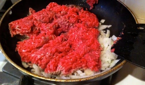 Brown ground beef with onions
