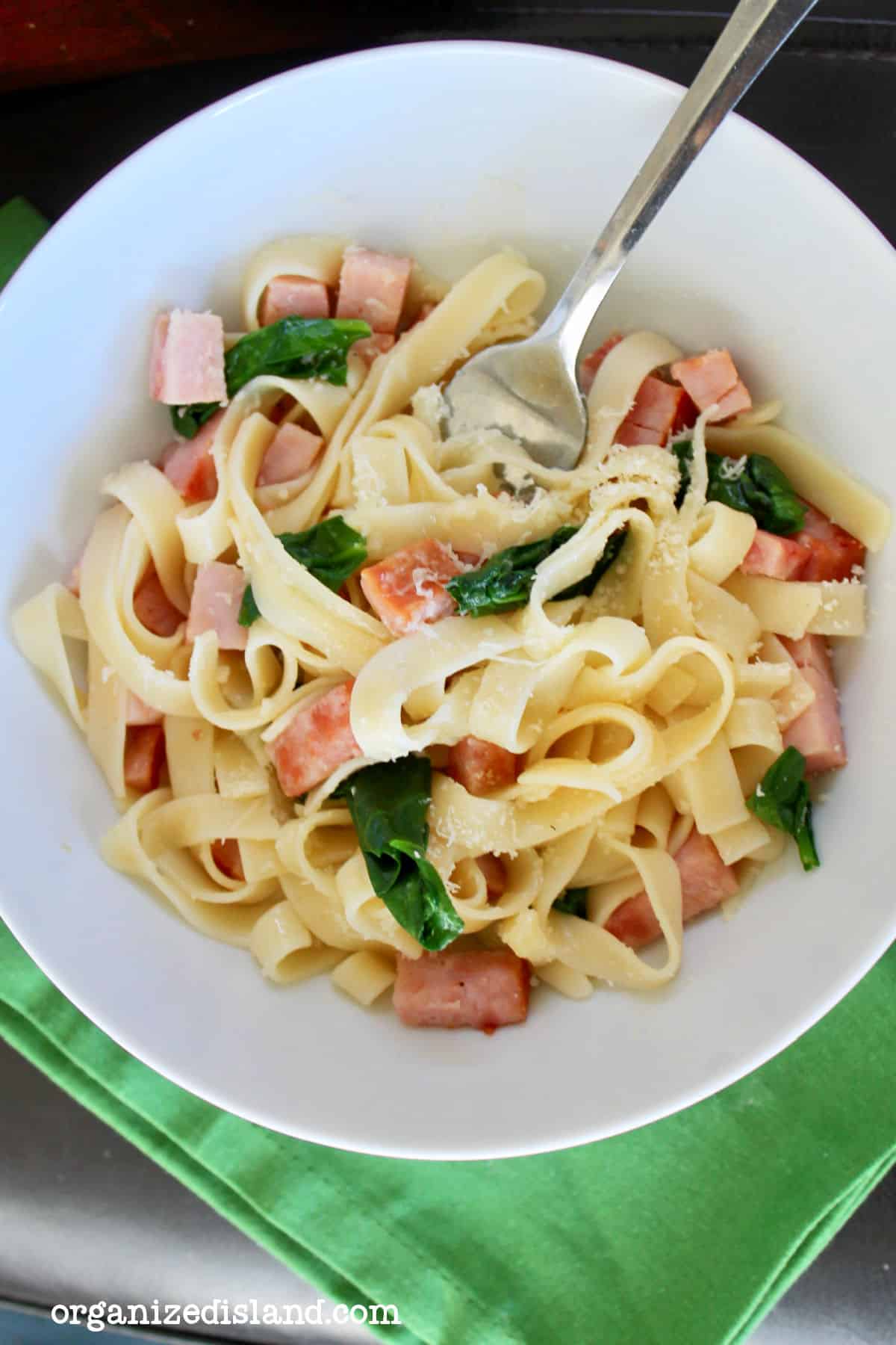ham spinach pasta in bowl.