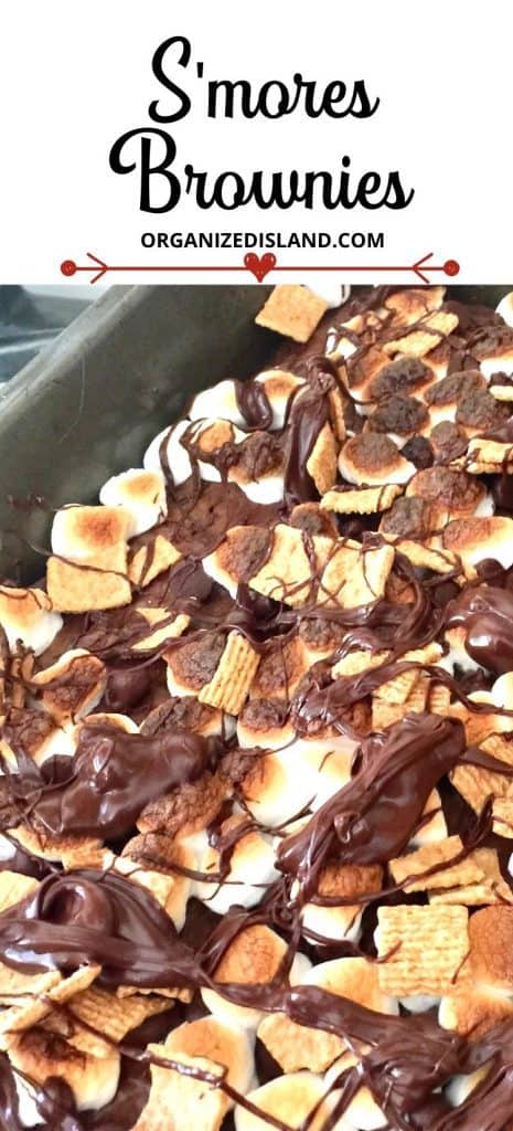 S'mores Brownies topped with marshmallows and chocolate in baking pan.