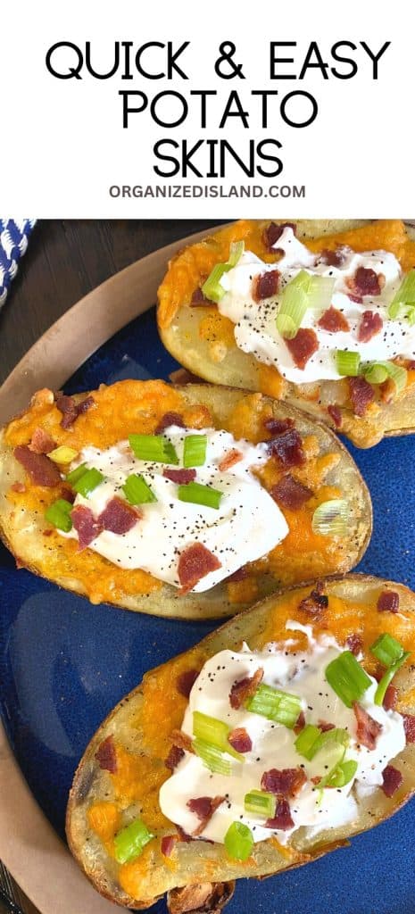 Stuffed Potato Skins with cheese, sour cream, onions and bacon on a plate.