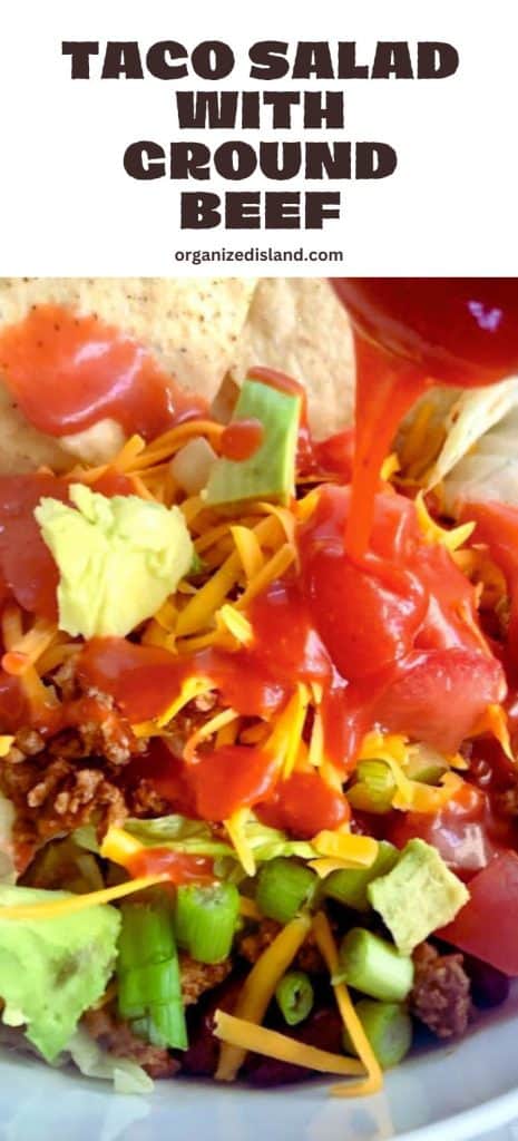 Taco Salad with Ground Beef in bowl with tortilla chips.