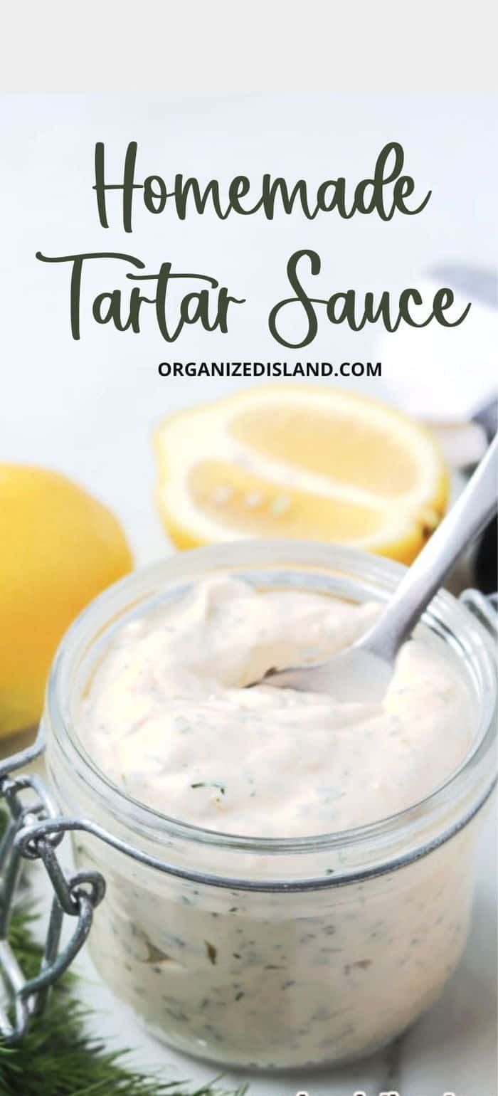 tartar sauce in jar next to lemon.