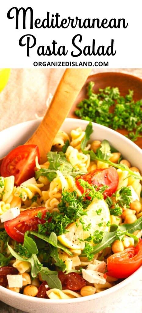 Mediterranean Pasta Salad in bowl with spoon.