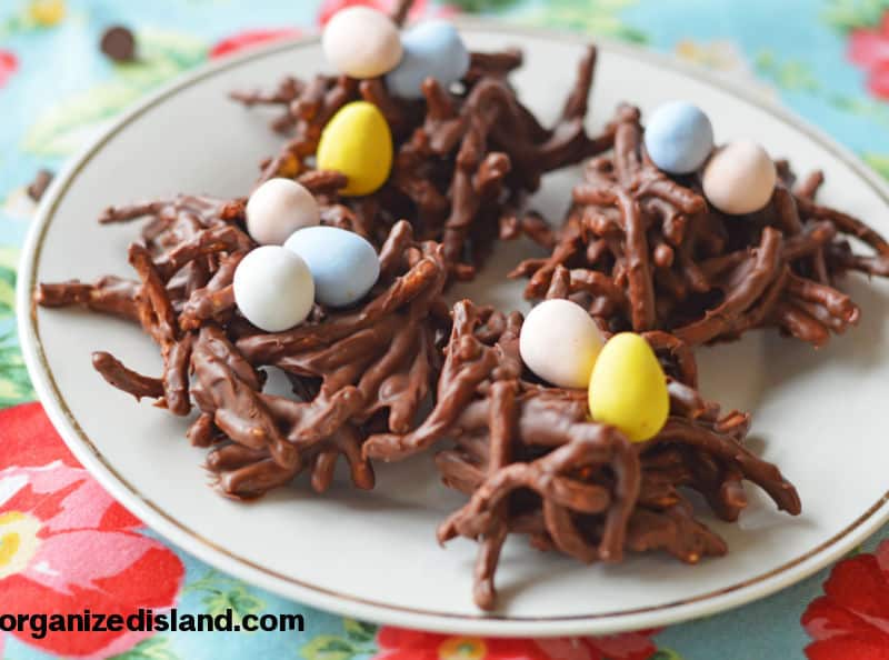 Bird Nest Cookies with chocolate eggs on a plate.