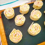 Ham and Cheese Roll Up appetizers on tray.