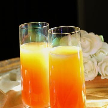 Tequila Sunrise Mimosas on table.
