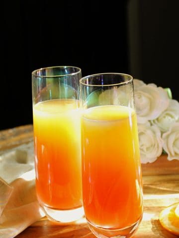 Tequila Sunrise Mimosas on table.