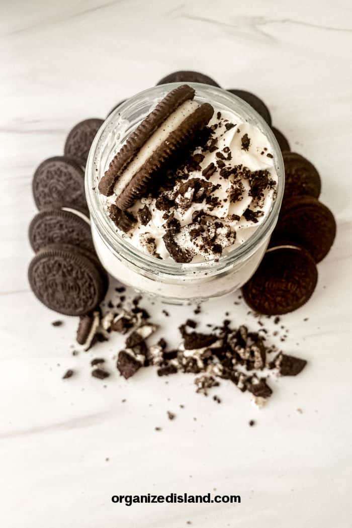 Oreo McFlurry in glass topped with oreos and cruubs.