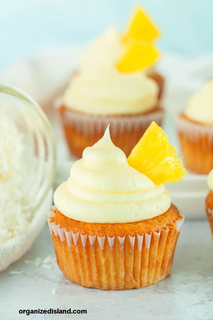 Easy Pina Colada Cupcakes with pineapple wedge