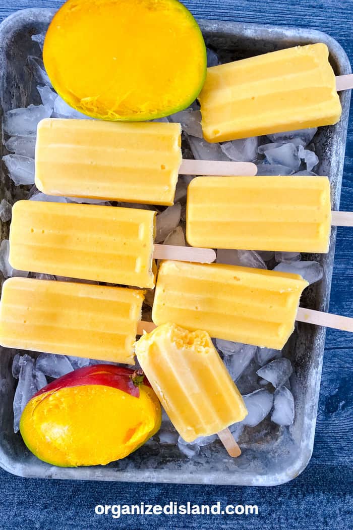 Mango Popsicles with mfresh mango on ice.