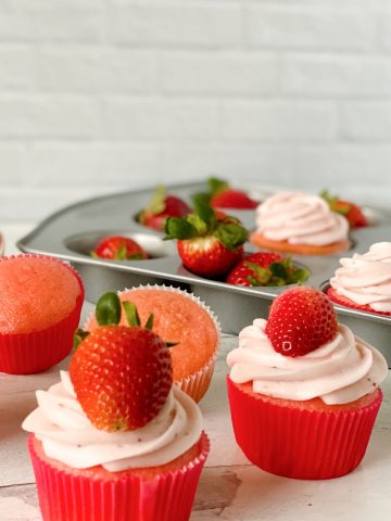 strawberry cupcakes next to pan.