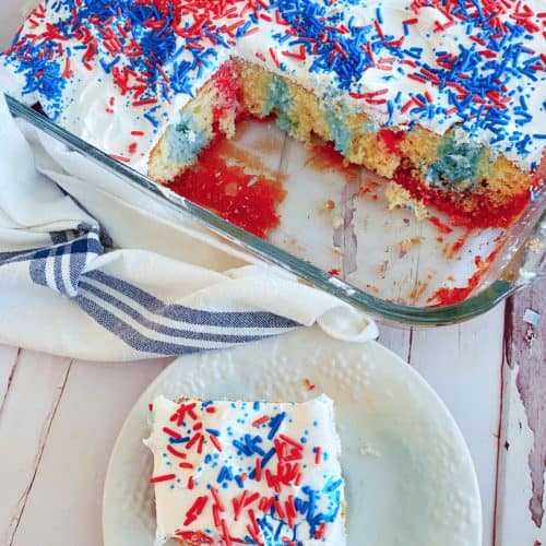 4th of July Poke Cake with slice.