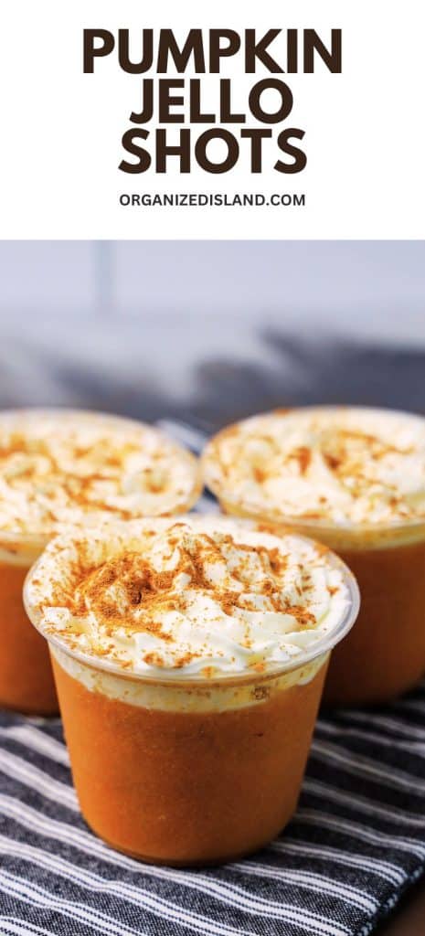 Pumpkin Jello Shots topped with whipped cream and cinnamon