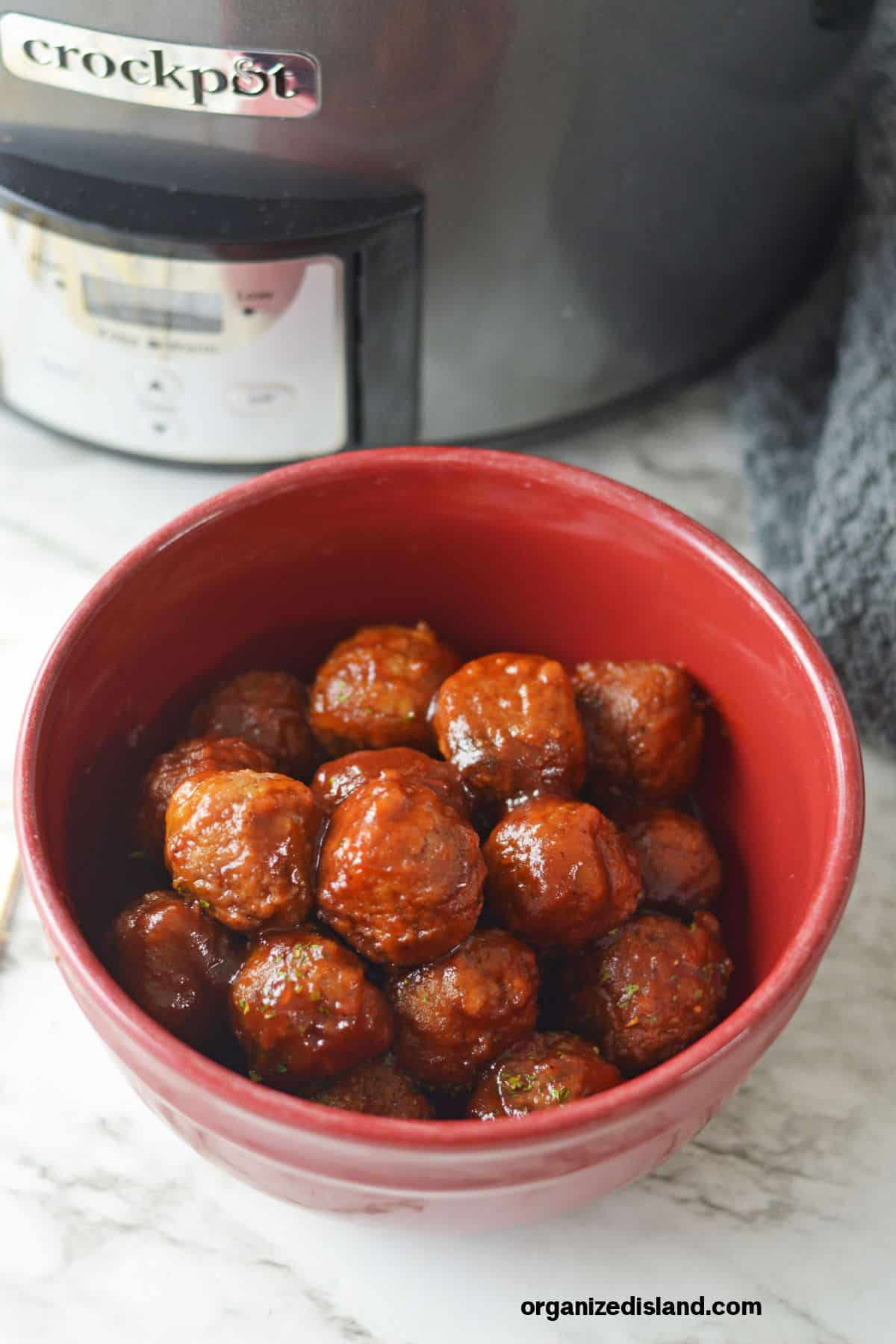 Slow cooker Slow cooker Cranberry Sauce Meatballs in bowl with slow cooker.