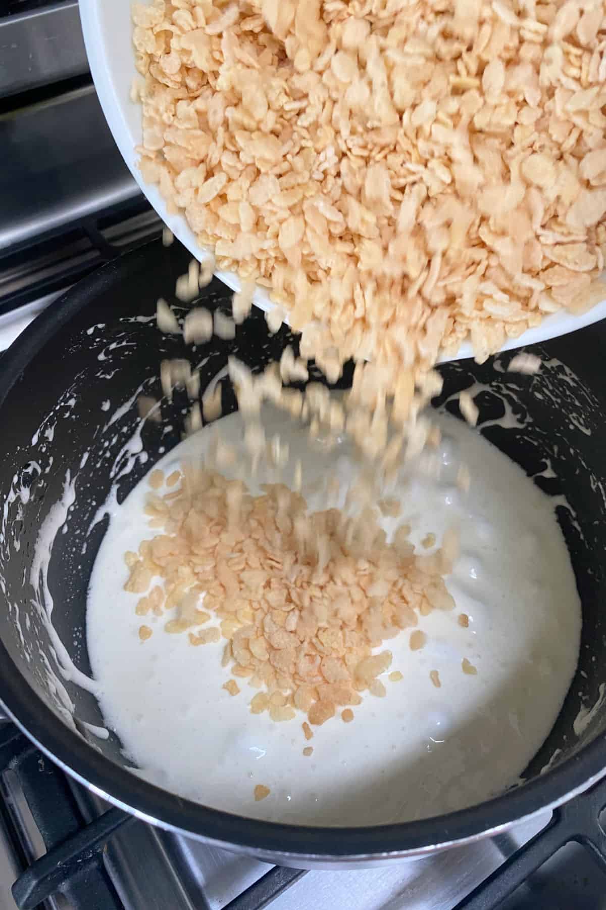 How to Make Strawberry Rice Krispie Treats step 2 adding rice cereal to pan.