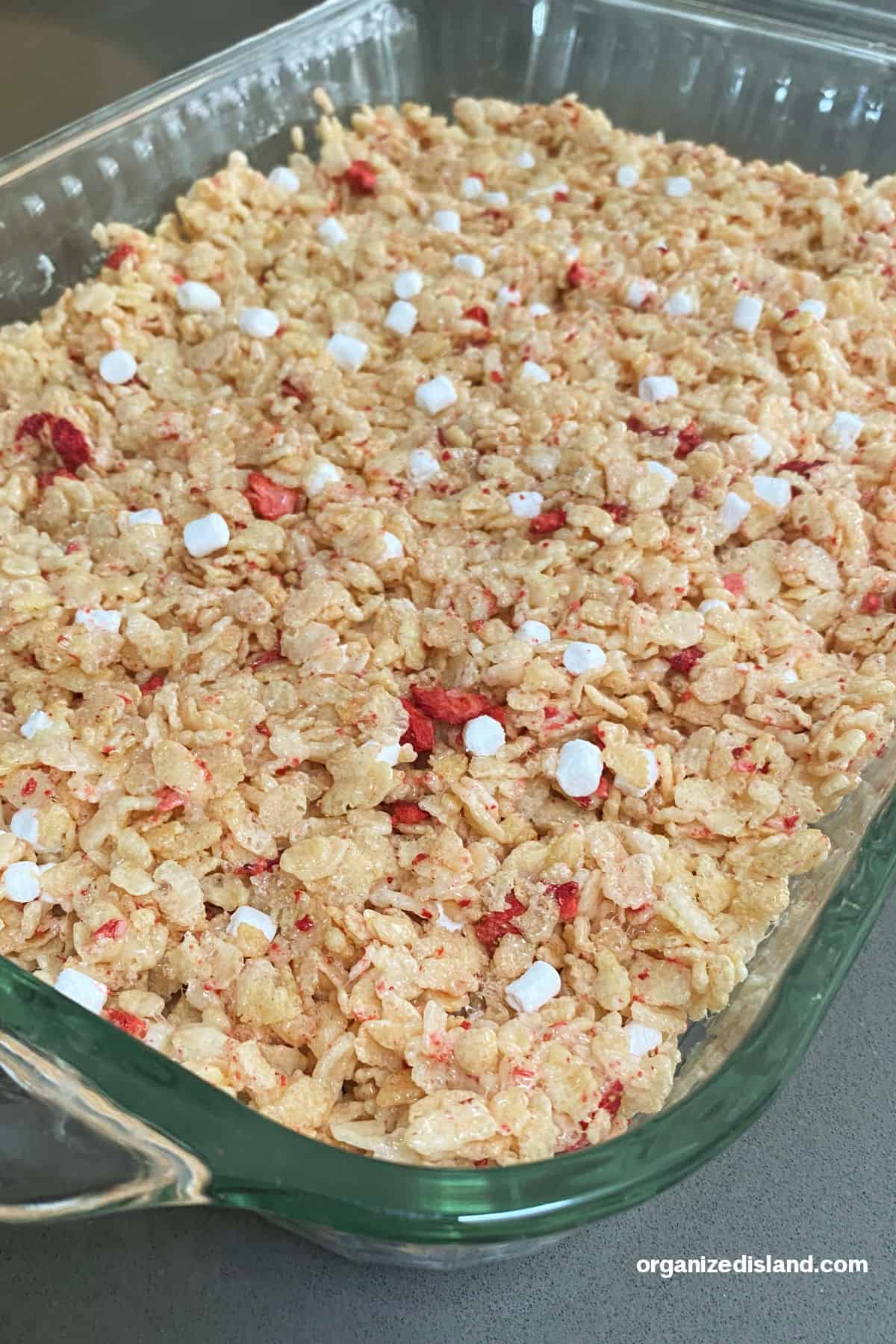 How to Make Strawberry Rice Krispie Treats step 5 pouring into baking pan.