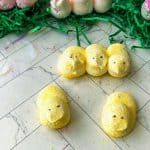 Homemade peeps on counter with faux grass.