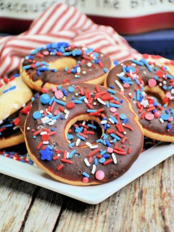 4th of July Cookies with red white and blue sprinkles on plate.
