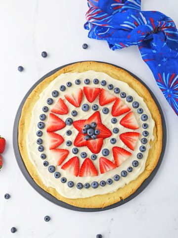 4th of July Fruit Pizza with strawberries and blueberries.