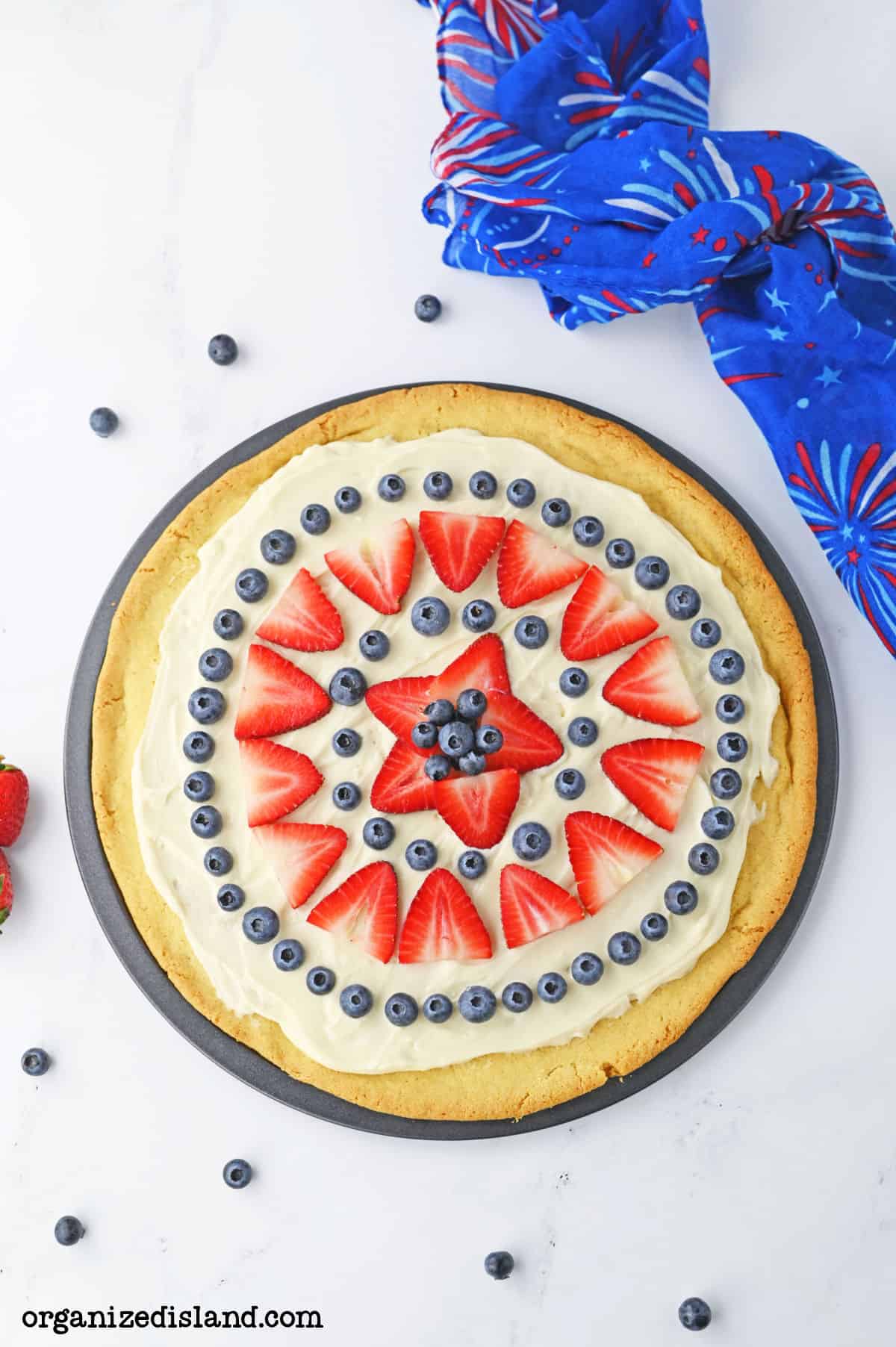 4th of July Fruit Pizza with strawberries and blueberries.