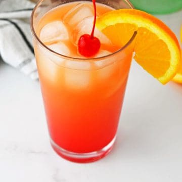 Bacardi Rum Punch in glass with cherry on tip.