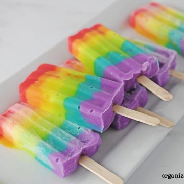 Rainbow popsicles on tray.