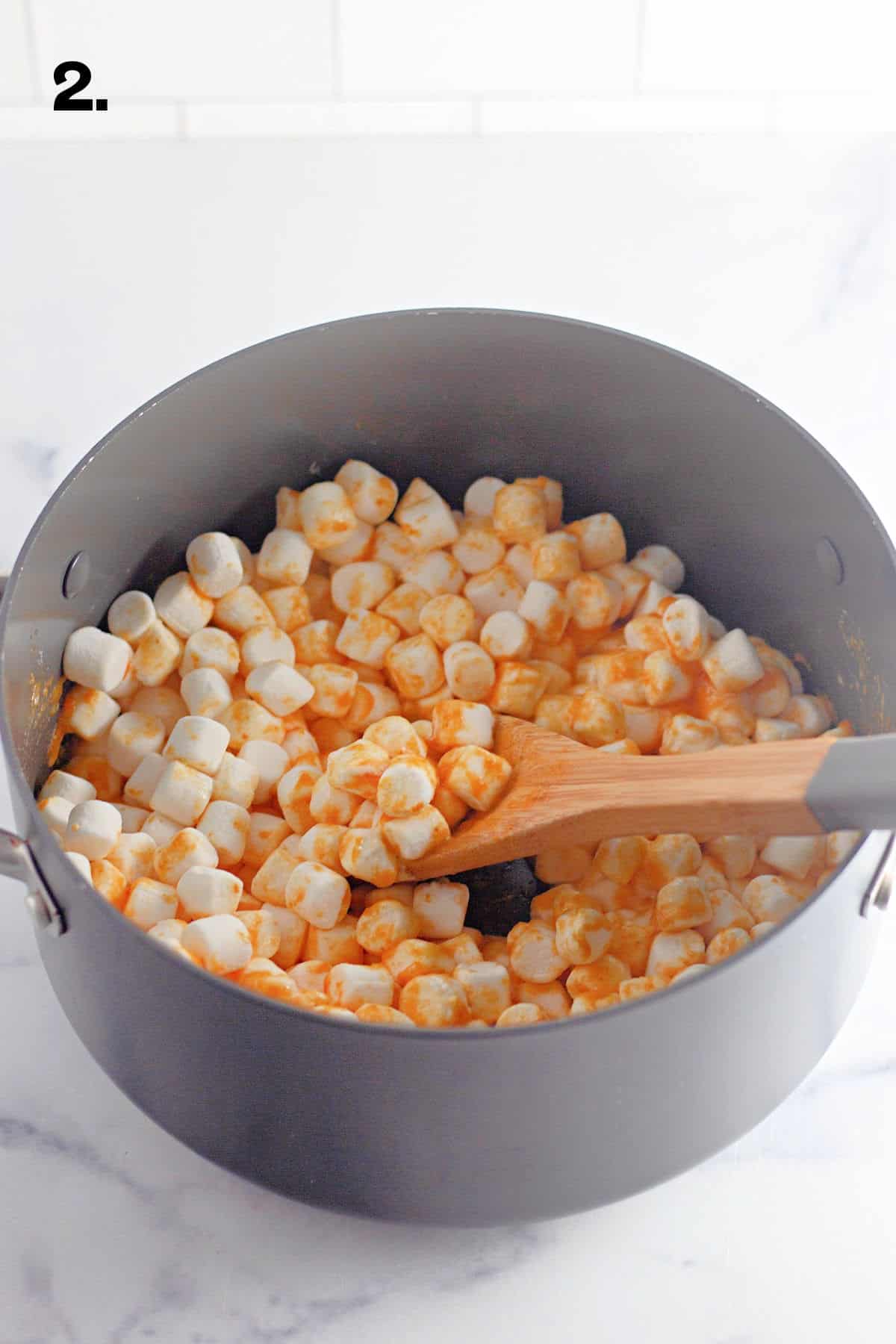 How to Make Pumpkin Spice Rice Krispie Treats Step 2 - adding marshmallows in pan.