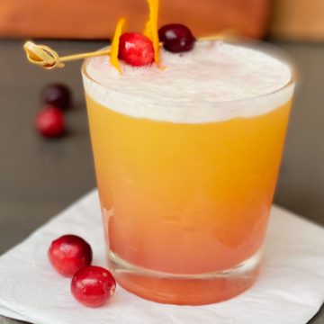 Cranberry Orange Whiskey Sour in cocktail glass.