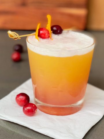 Cranberry Orange Whiskey Sour in cocktail glass.