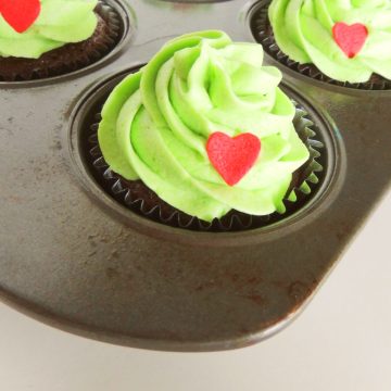 Grinch Cupcakes in pan.