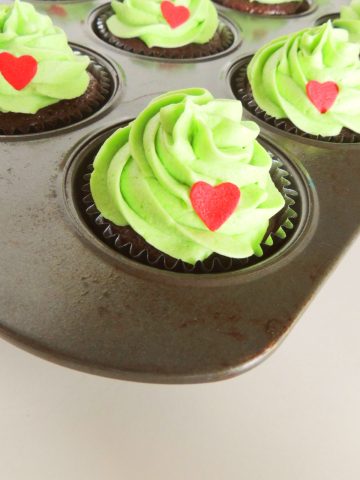 Grinch Cupcakes in pan.