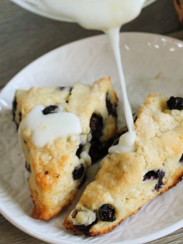 Blueberry scones drizzled with icing.