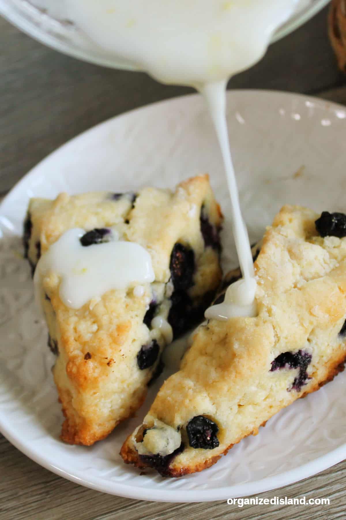Blueberry scones drizzled with icing.