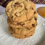 Chewy Chocolate Chip Cookies stacked on plate