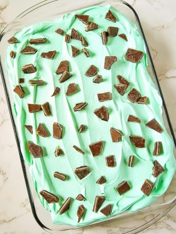 Chocolate Mint Cake in pan with Andes Mints on top.