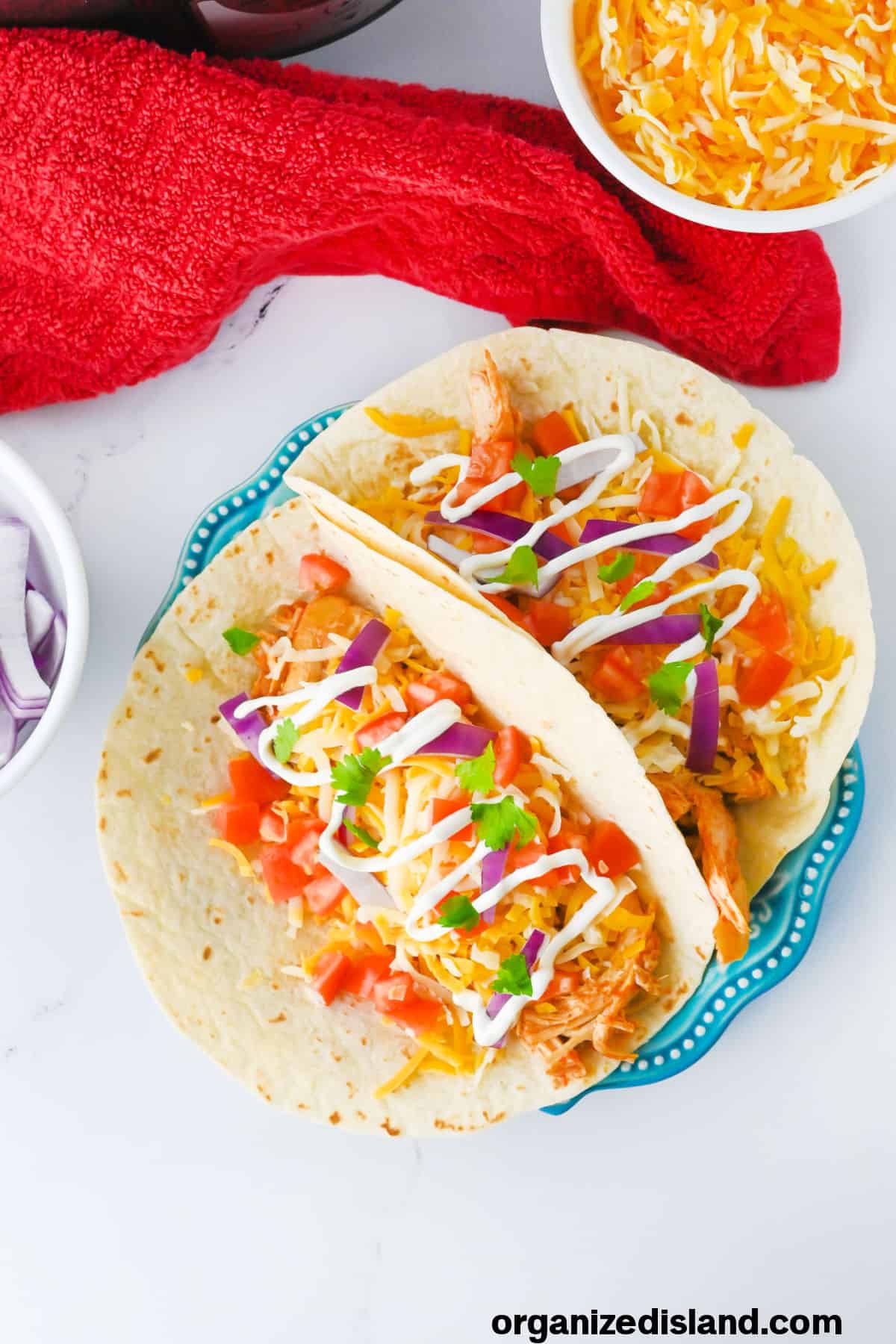 Easy Crock Pot Chicken Tacos made in slow cooker on plate.