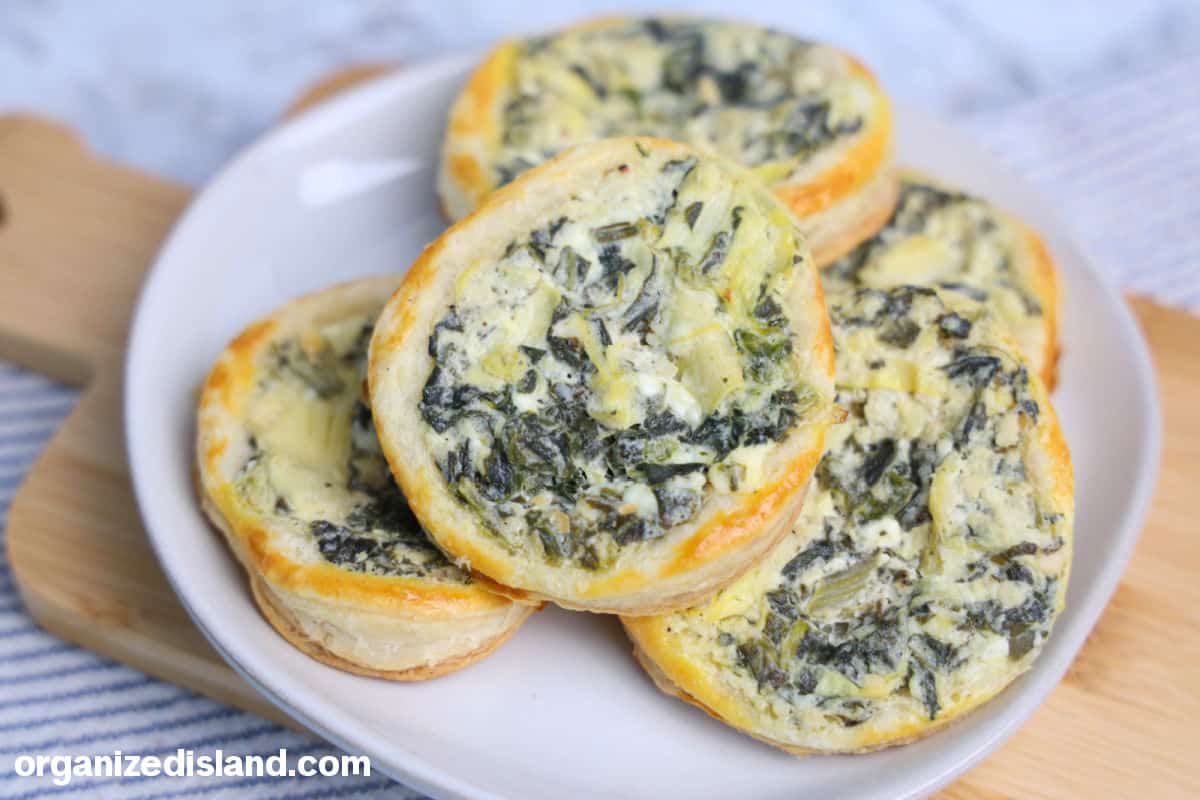 Easy Spinach Tartlets on dish landscape photo.