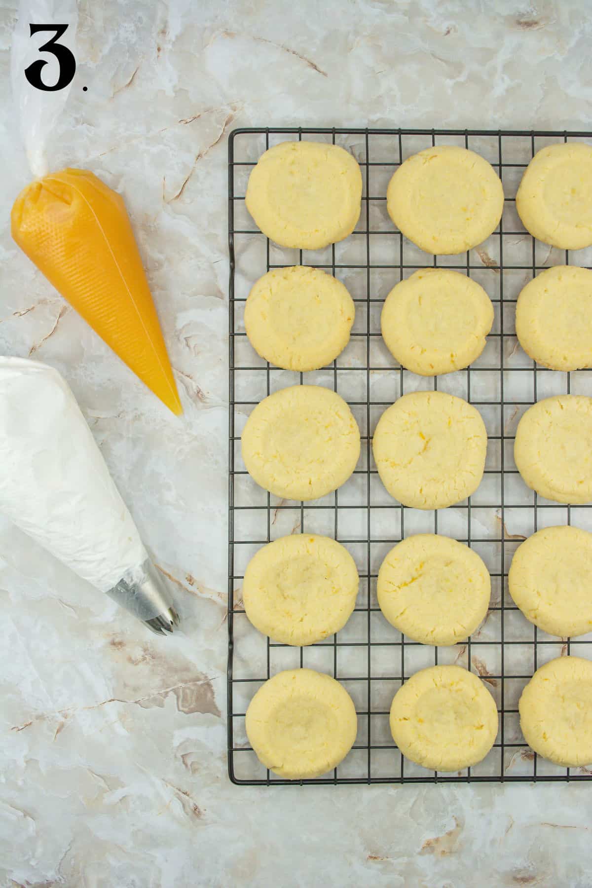 How to Make Lemon Meringue Cookies Step 3 unfrosted cookies on wire rack.