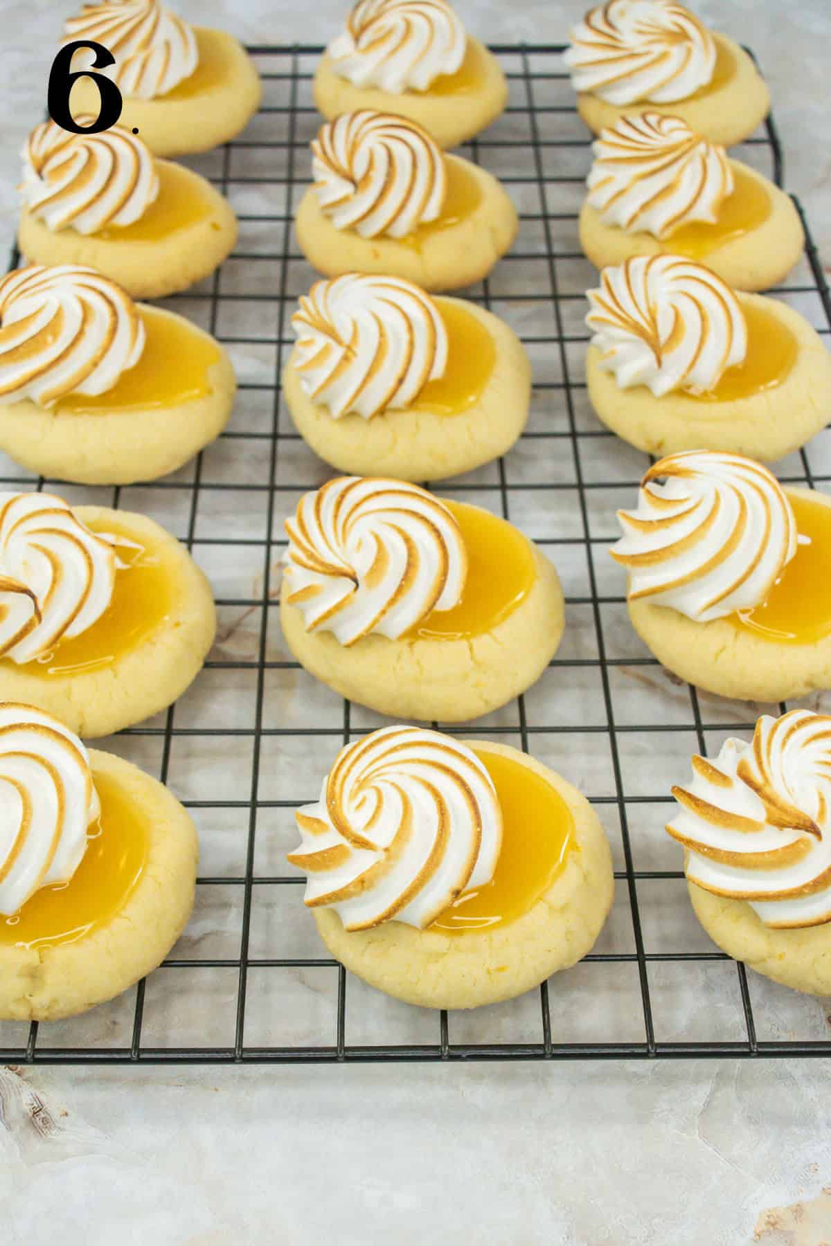 How to Make Lemon Meringue Cookies Step 6 - cookies with lemon curd and torched meringe.