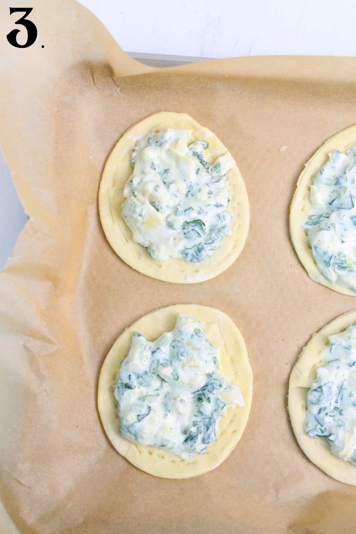 How to make Spinach tartlets -adding spinach mixture to tart.