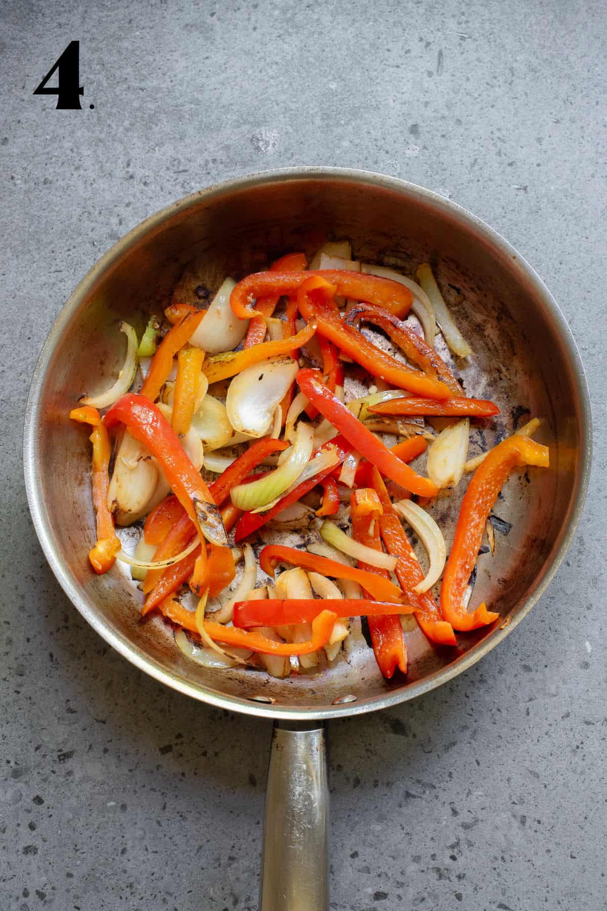 How to Make Black Pepper Chicken - Step 4 - stir fry vegetables in pan.