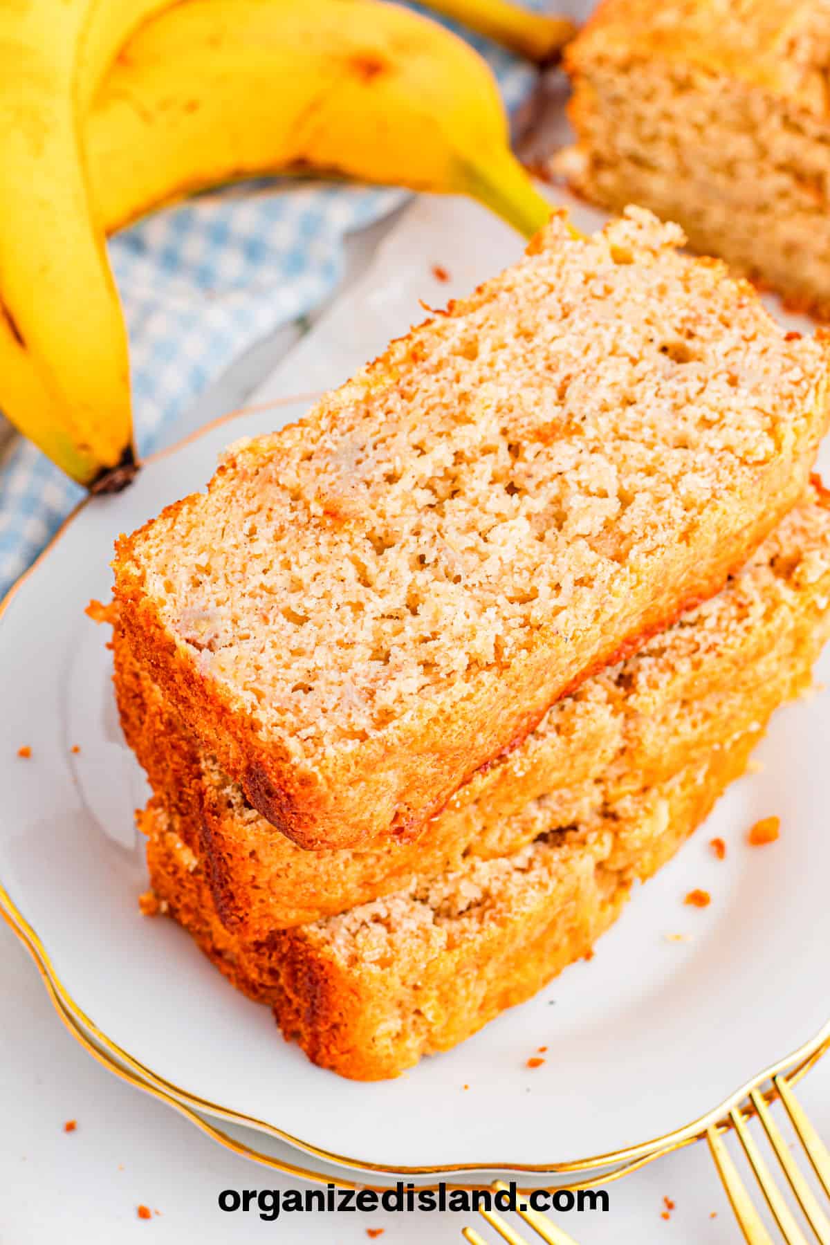 Easy Bisquick Banana Bread on plate with bananas