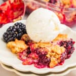 Blackberry Cobbler with a scoop of ice cream on plate