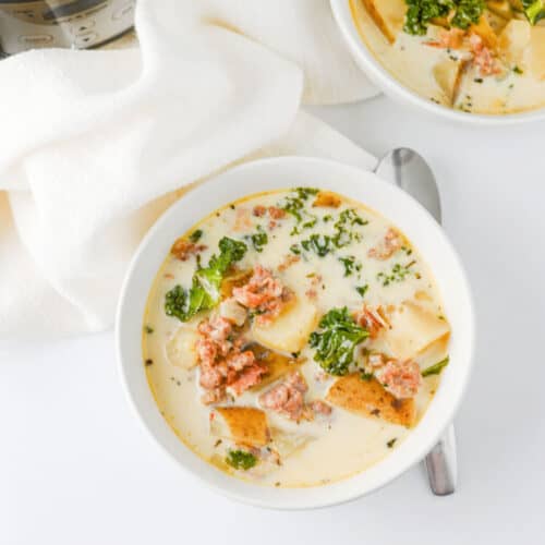 Crock Pot Zuppa Toscana next to slow cooker.