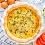 Easy Zucchini Quiche on a white pie plate.