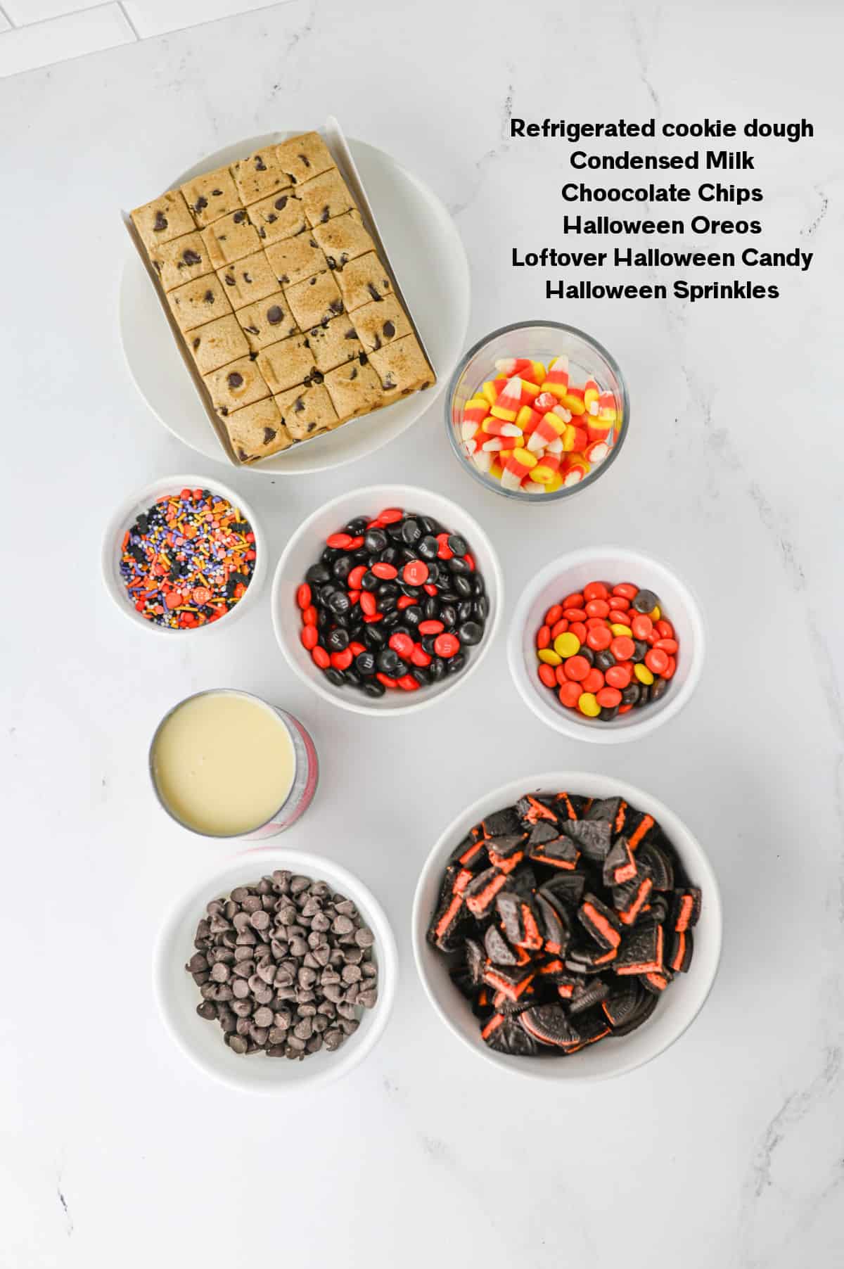 Halloween Cookie Bars Ingredients - dough, leftover HAlloween candy, chocolate chips.