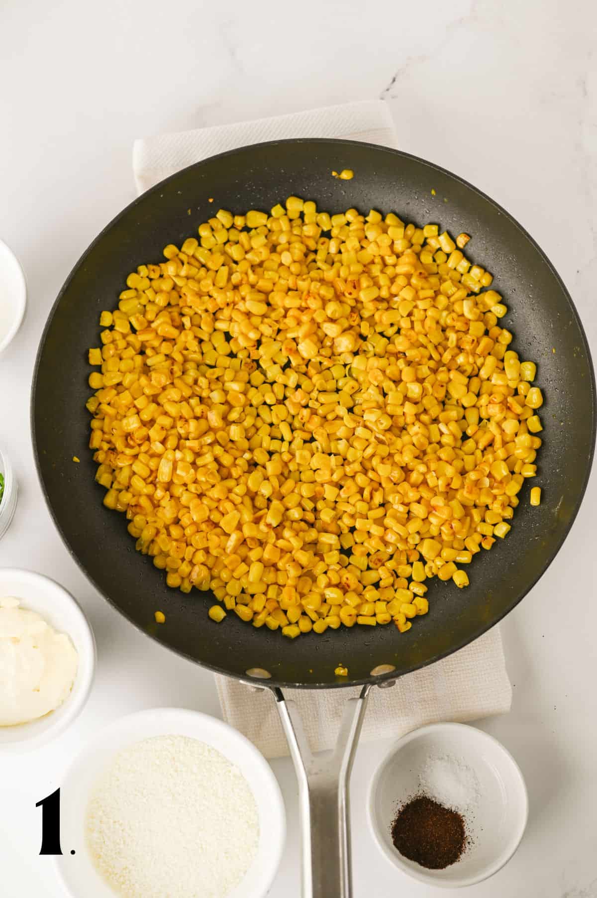 _How To Make Elotes Cups Step 1 - sharring corn in skillet.