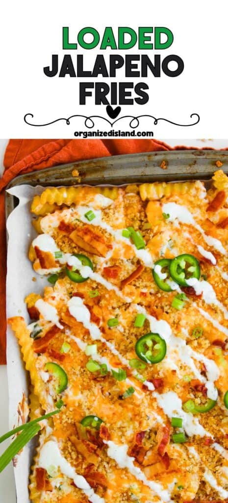 Loaded JalapenĢo Fries on baking sheet, drizzled with sour cream.